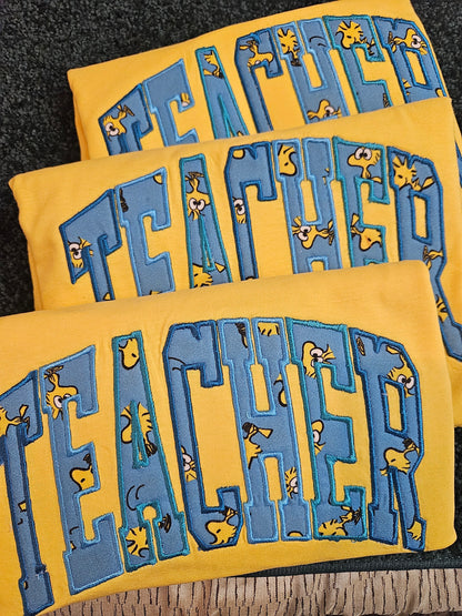 Teacher-Woodstock-Applique T-Shirt